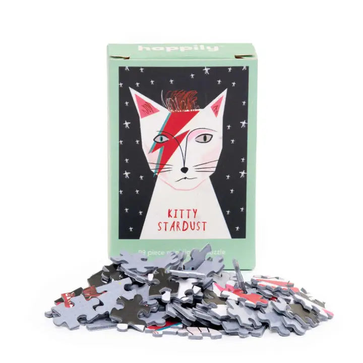 Jigsaw puzzle set with 'Kitty Stardust' design on a white background