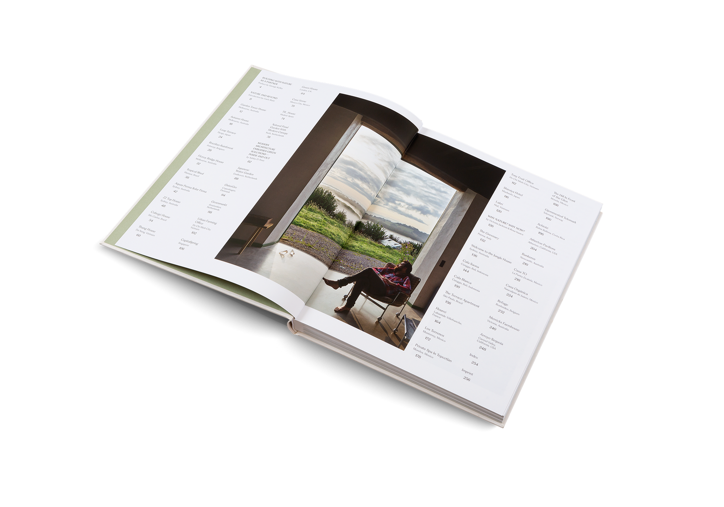 Open book with a photograph of a person sitting on a bench in a park.