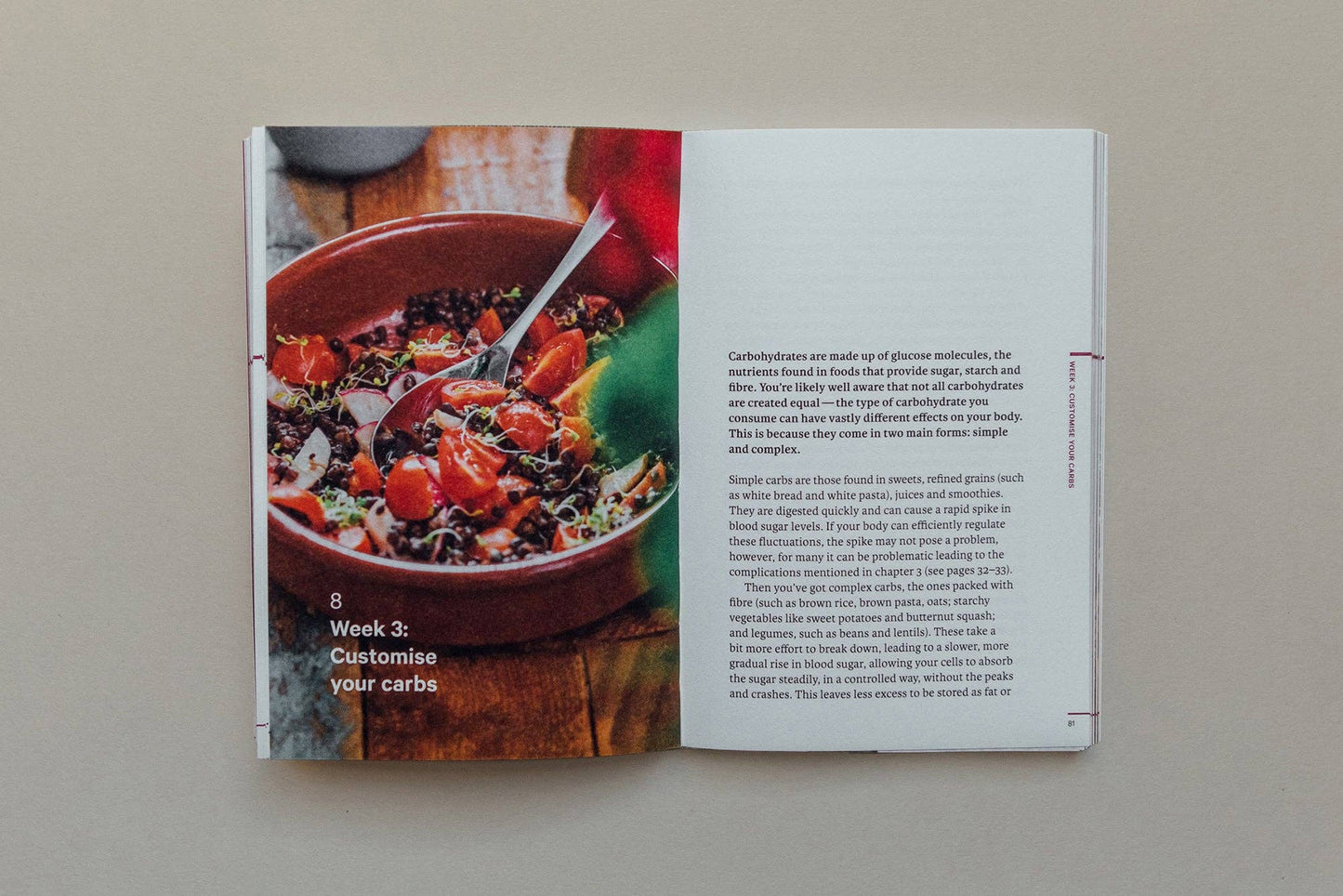 Open book showing a page with a bowl of salad and text on a neutral background