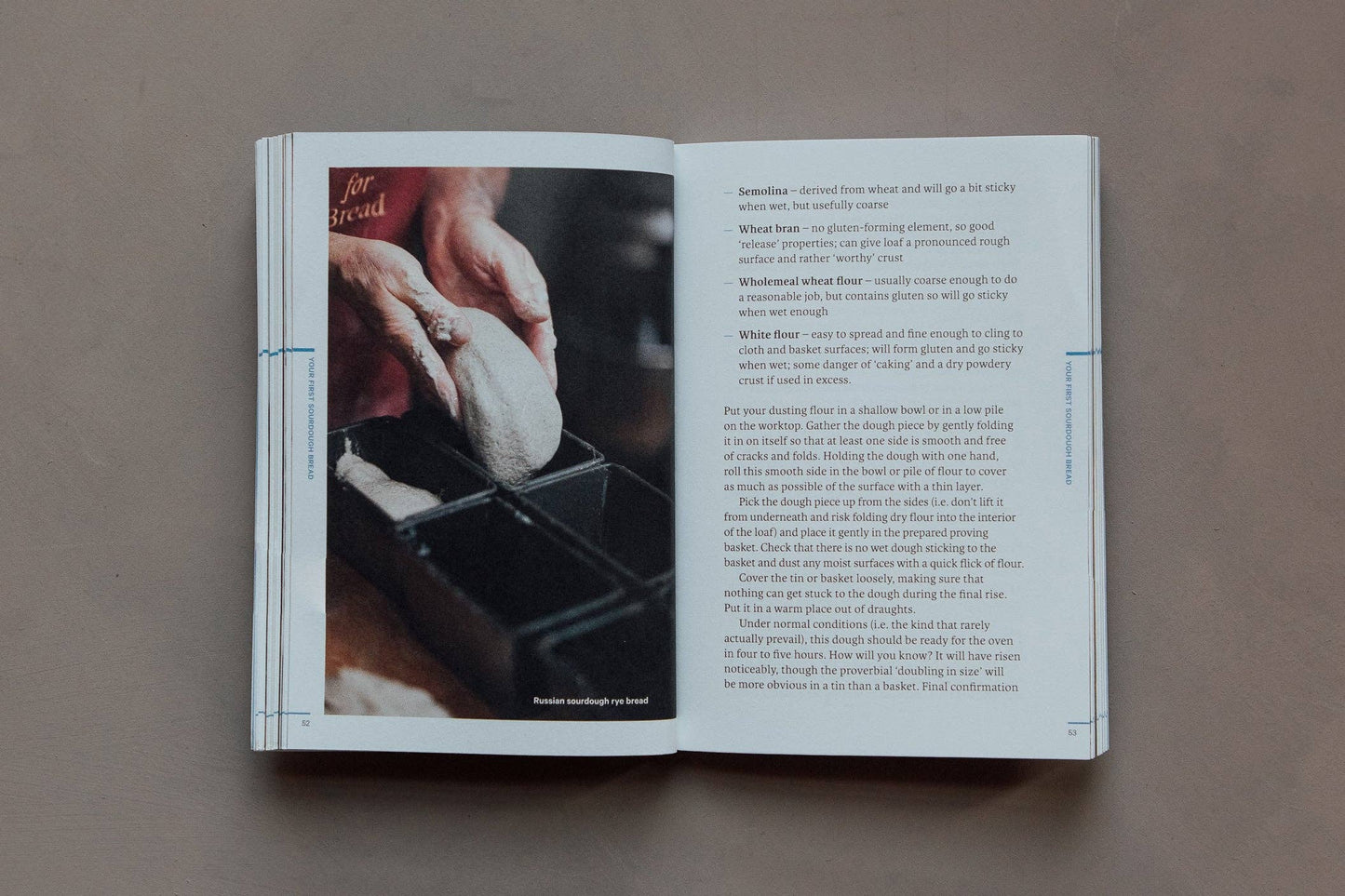 Open book with a recipe or cooking tutorial on a neutral background