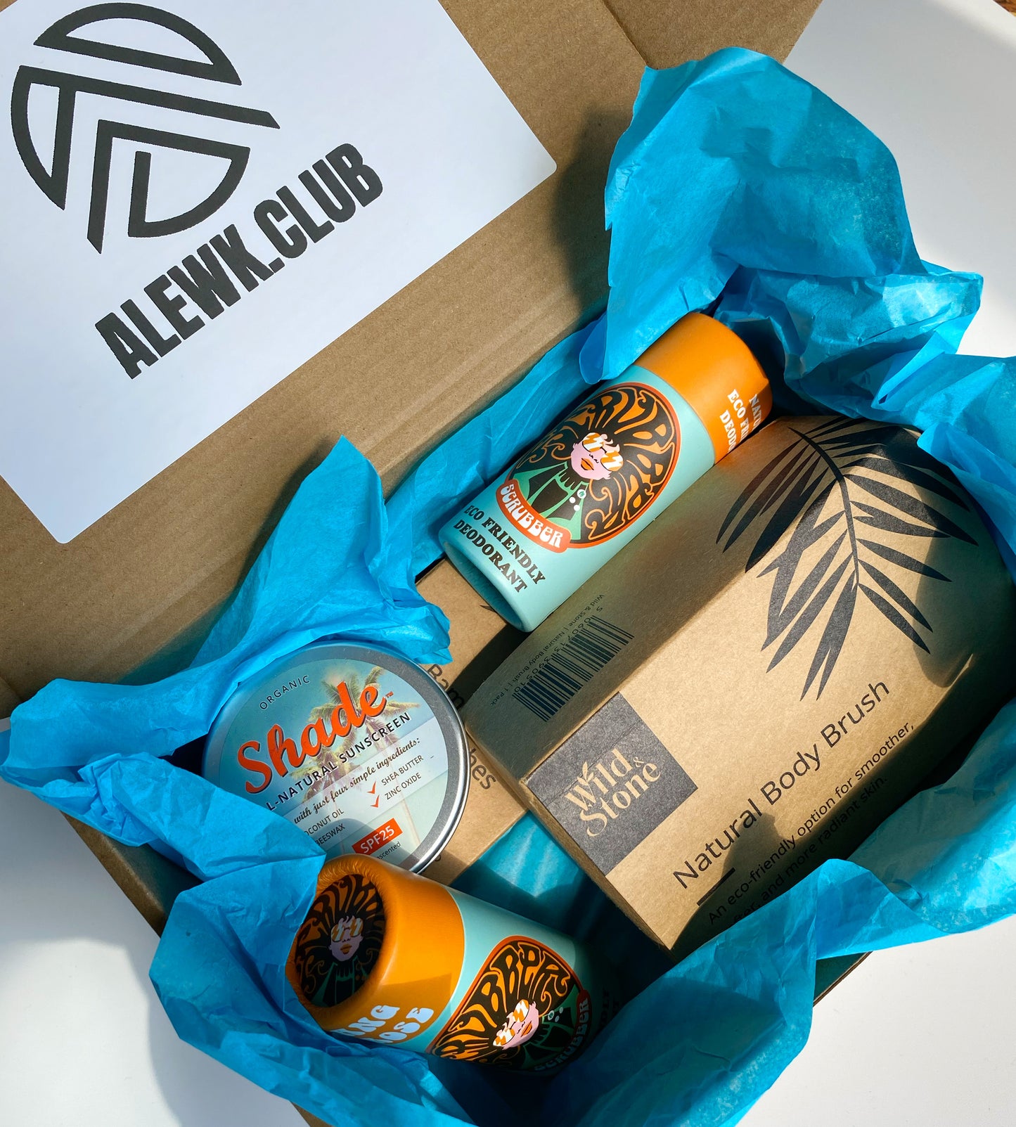 Eco Essentials Home Gift Set featuring bamboo toothbrushes, natural body brush, Ylang & Rose soap bars, and Shade all-natural sunscreen, arranged on a neutral background for a minimalist, sustainable lifestyle look