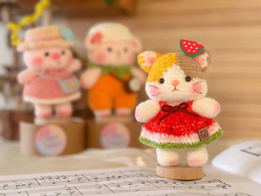 Baobao Family: Adorable Crochet Animal Collection featuring a cute kitty in a watermelon dress.