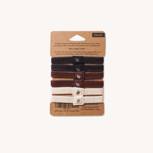 Set of hair ties in natural colors on a cardboard packaging with branding information.