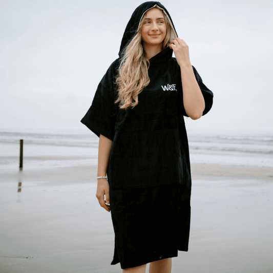 The Luxury Towel Robe in black, perfect for beach dips and poolside lounging.