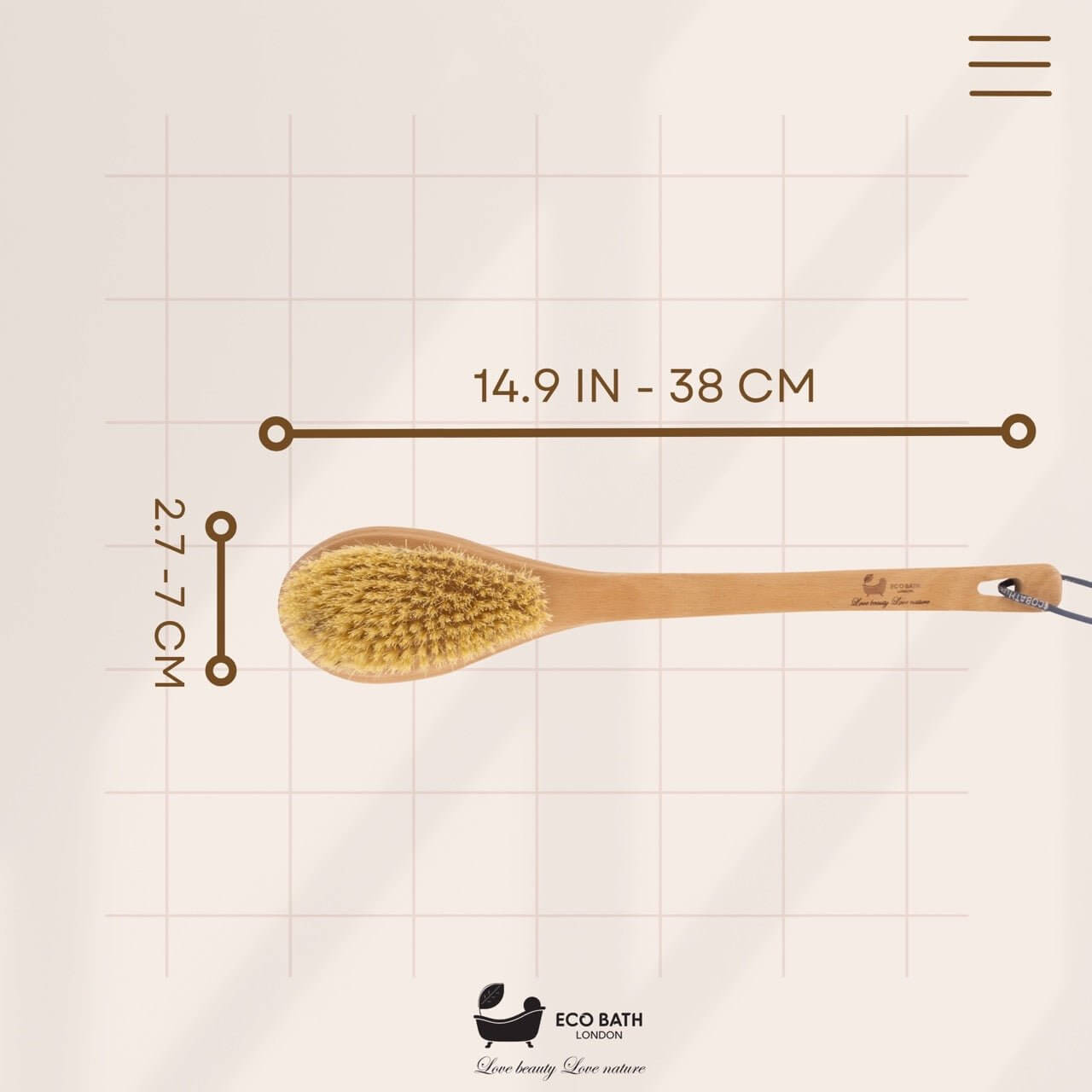 Wooden brush with measurement details on a grid background, featuring the Eco Bath London logo.