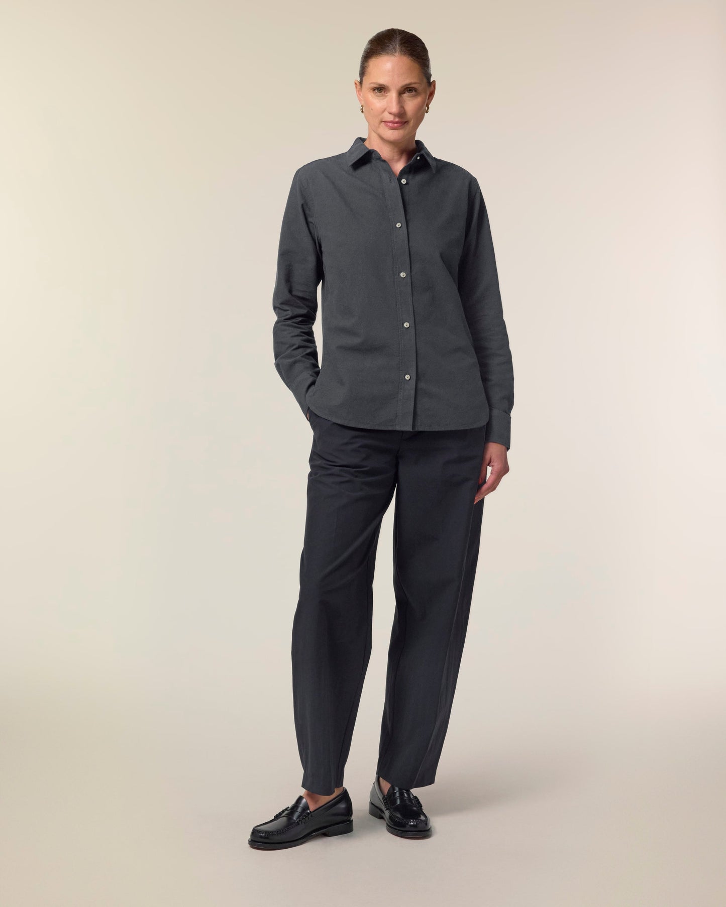 Organic Cotton Oxford Long Sleeve Shirt: Womens model wearing a stylish dark shirt with tailored fit and breathable fabric.