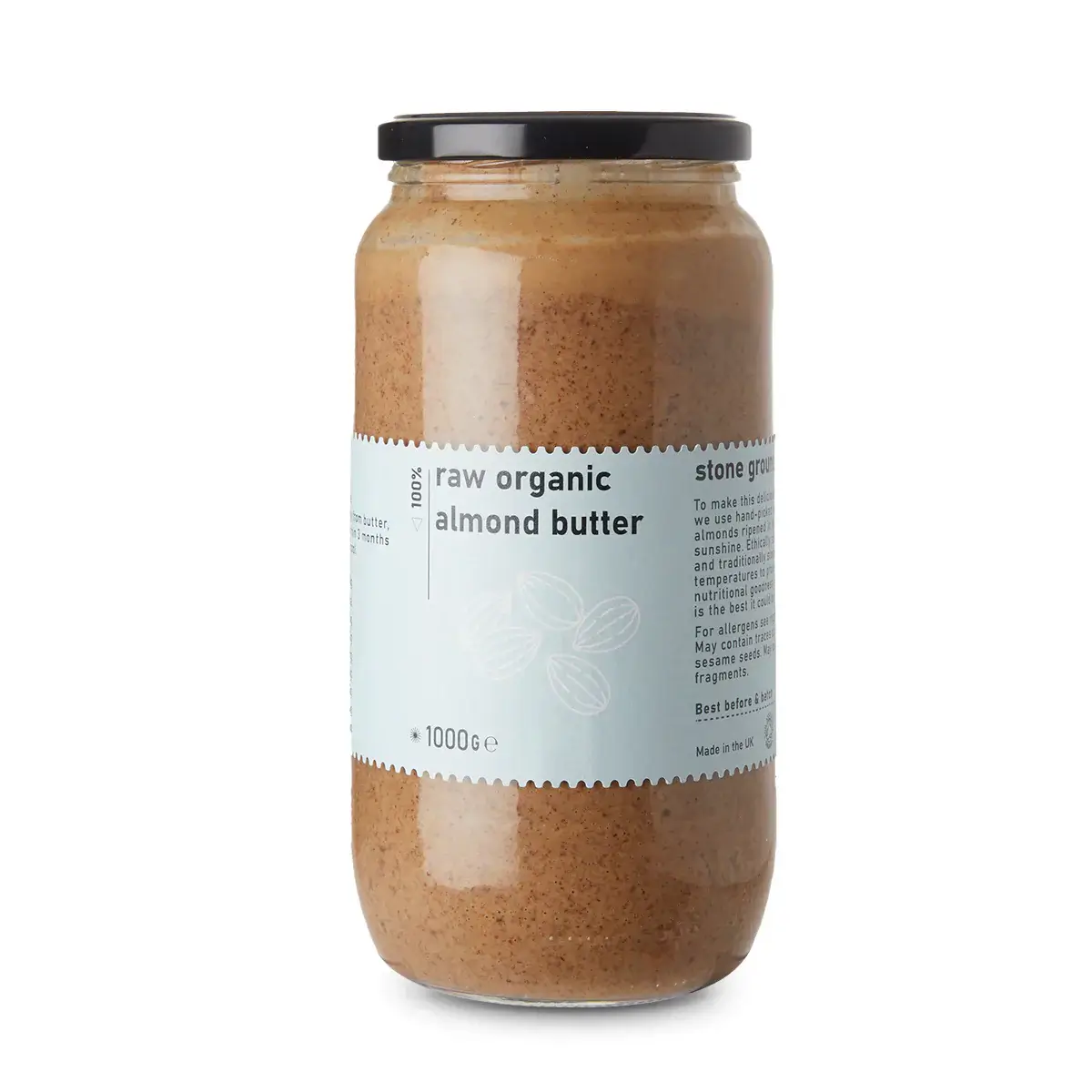 Jar of raw organic almond butter on a white background