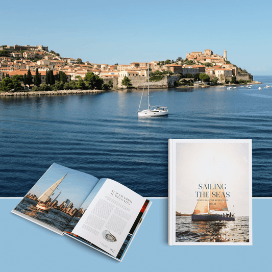 Sailing the Seas Vol. 2 book cover and open pages with a sailing yacht in the background near Brighton and Hove, UK.