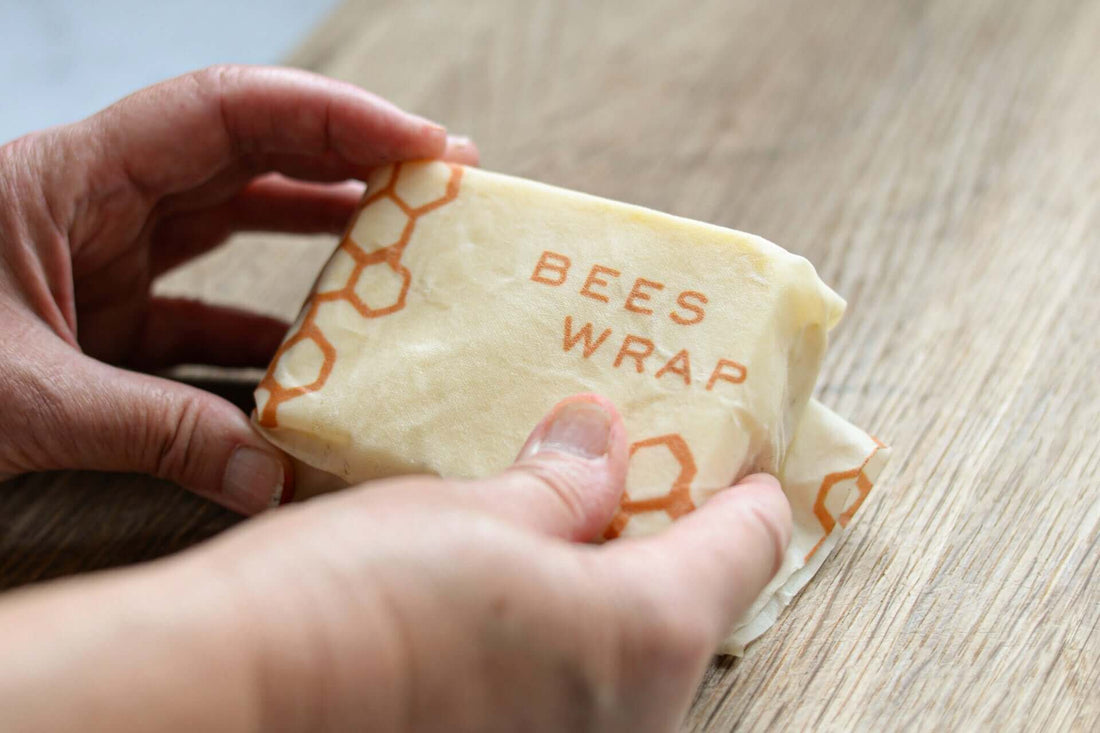 What Are the Benefits of Reusable Beeswax Food Wraps? holding beeswax wrap with honeycomb design