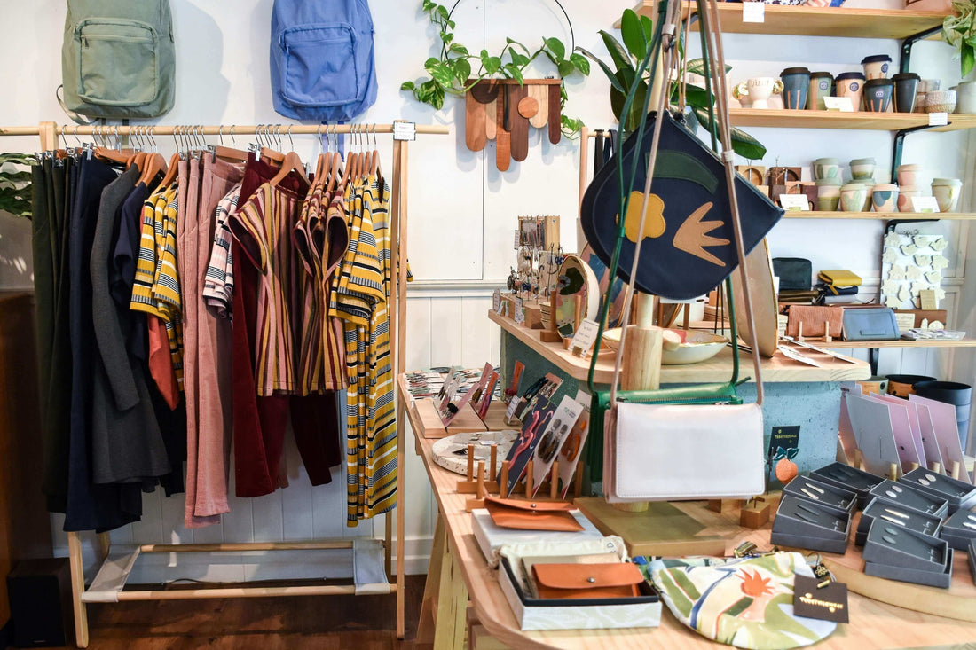 UK Shoppers Want Sustainable Fashion - But Can They Afford It? Clothing and accessories on display in a sustainable shop.