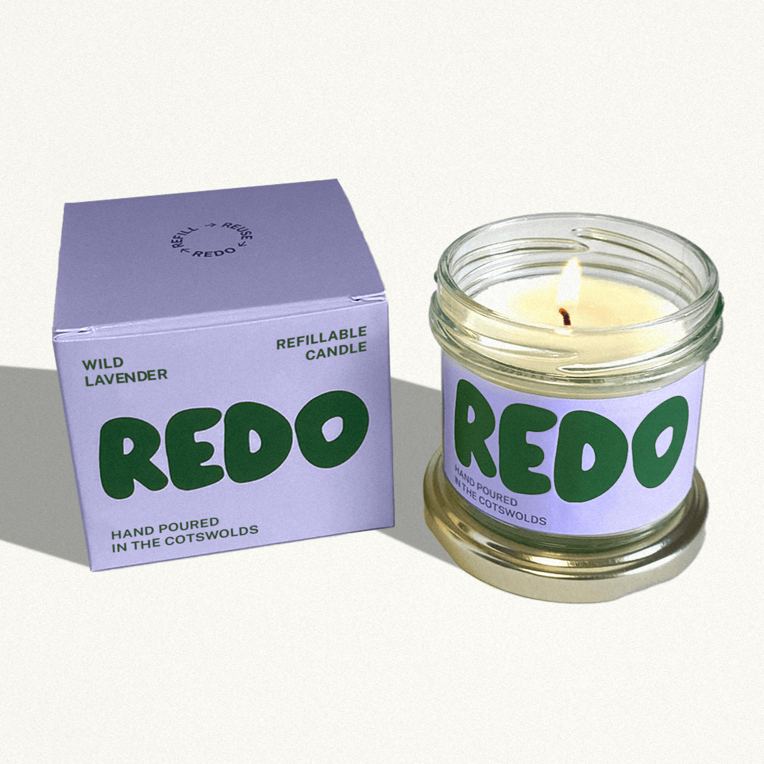 REDO candle and packaging on a white background