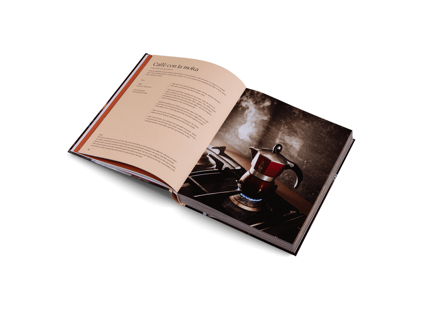 Open book with a photograph of a coffee pot on a white background