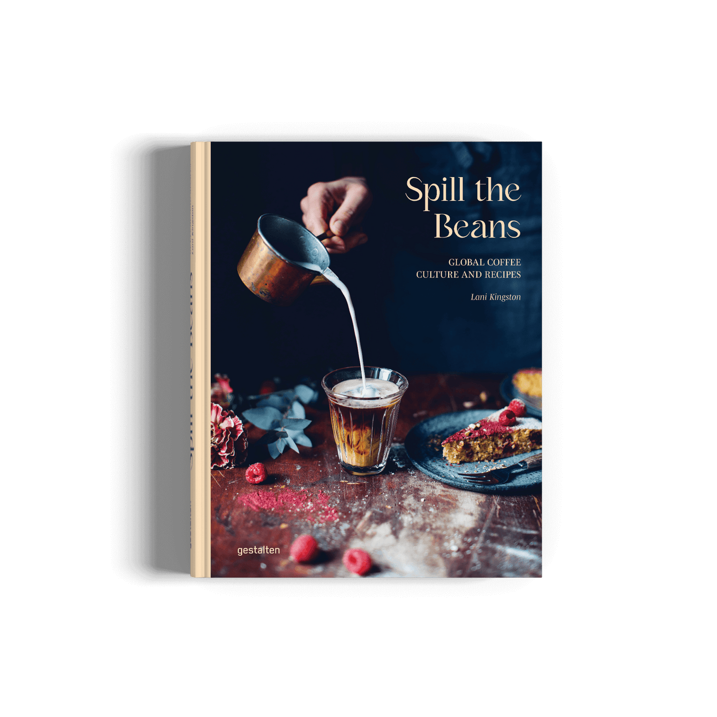 Book titled 'Spill the Beans' with a person pouring milk into a glass on a wooden table.