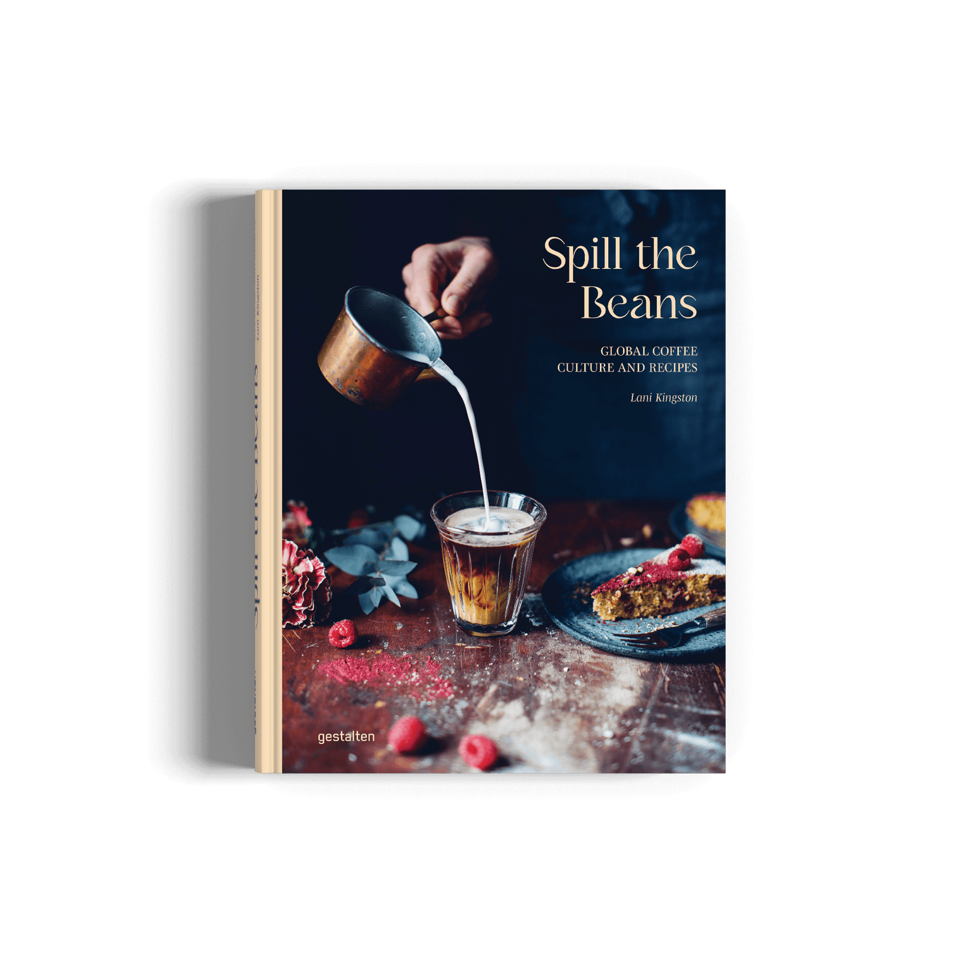 Book titled 'Spill the Beans' with a person pouring milk into a glass on a wooden table.