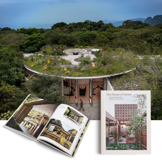Book titled 'The House of Green' with a scenic garden and building in the background
