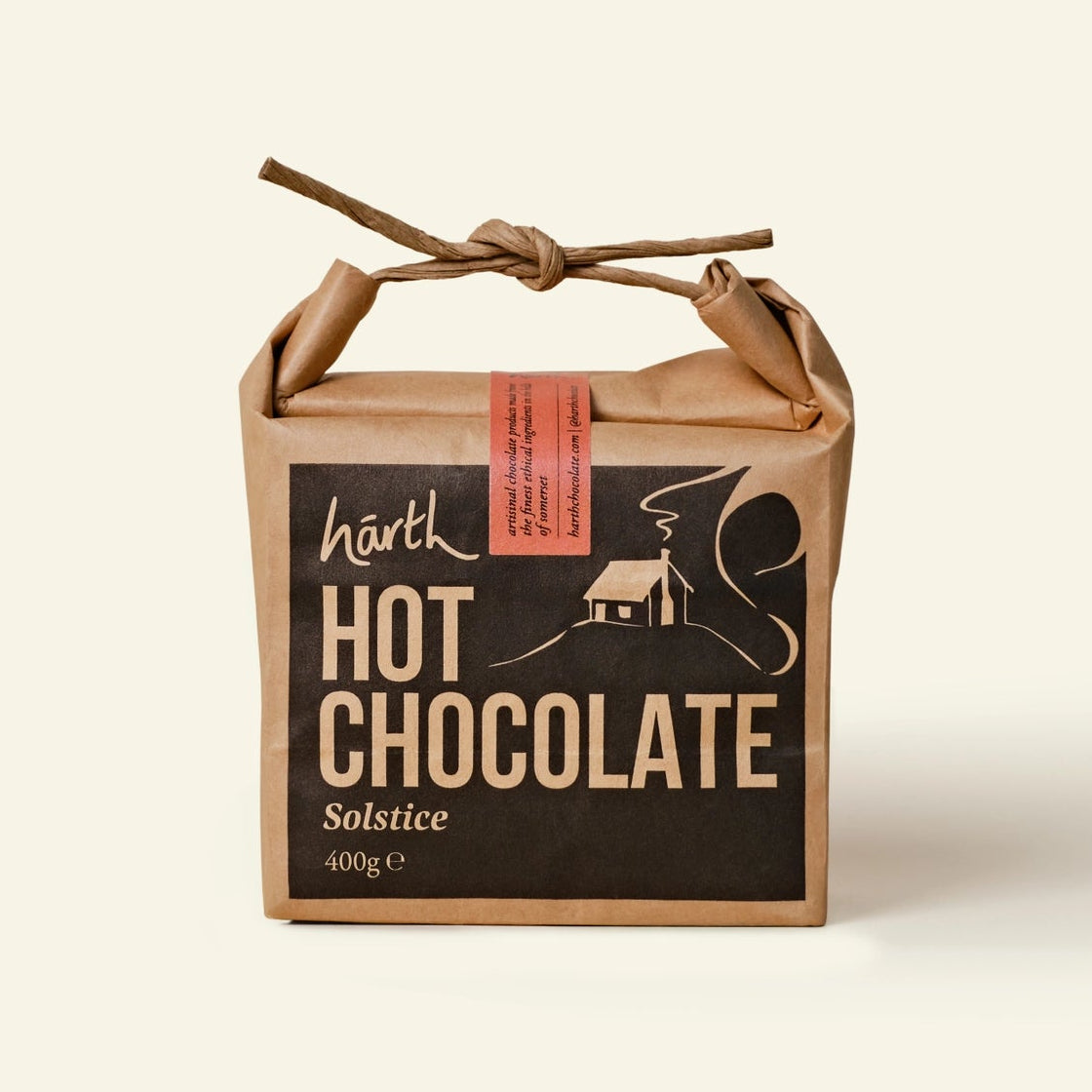 Box of hot chocolate with a rustic design on a beige background