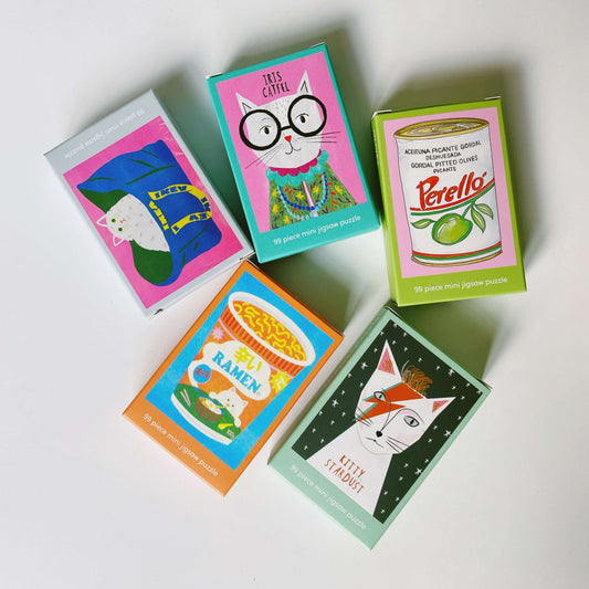 Five mini puzzle boxes with colorful illustrations on a white background