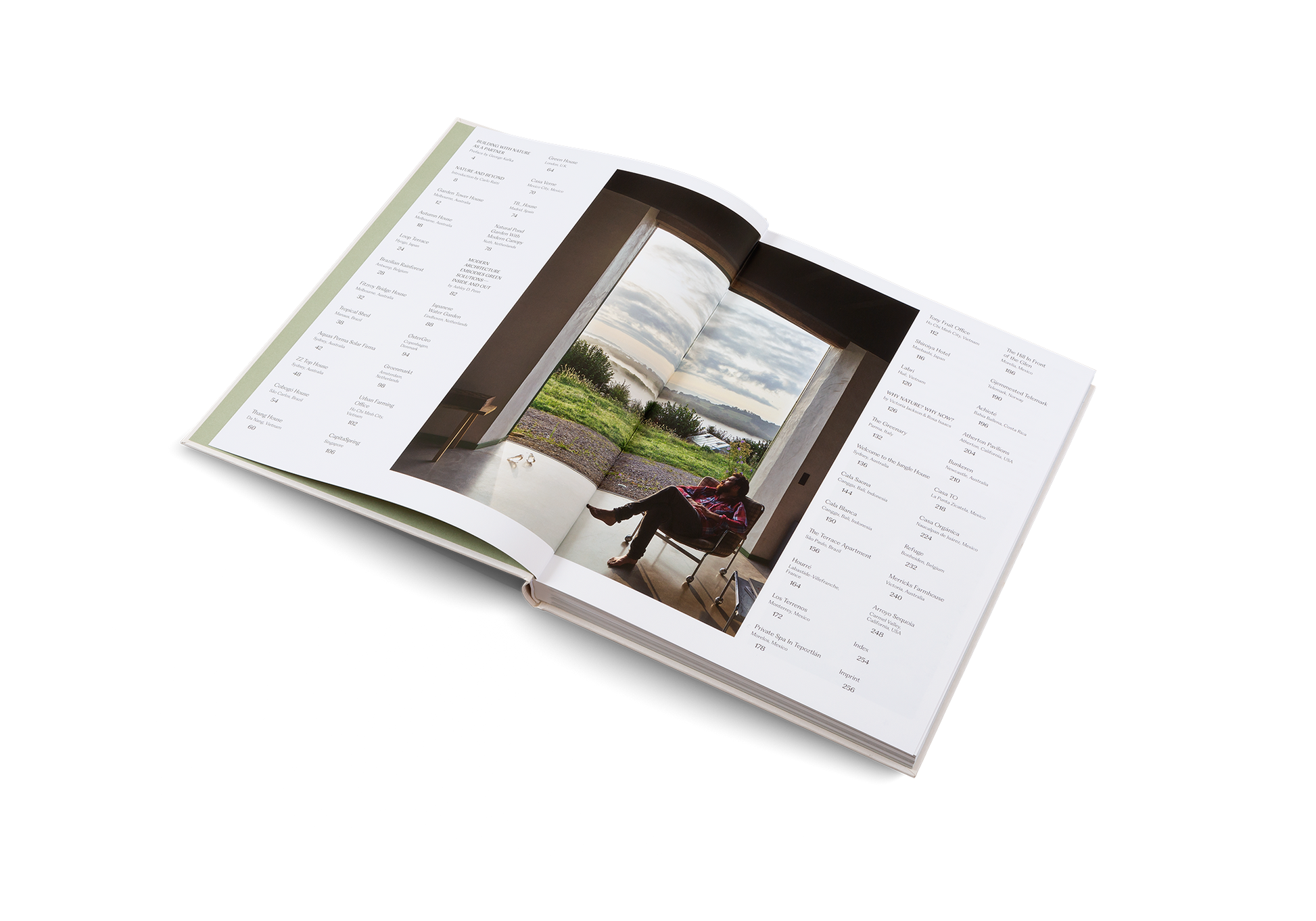 Open book with a photograph of a person sitting on a bench in a park.