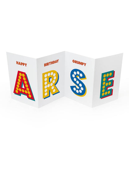 Concertina birthday card unfolded to spell ARSE in large colourful letters, with Happy Birthday Grumpy above
