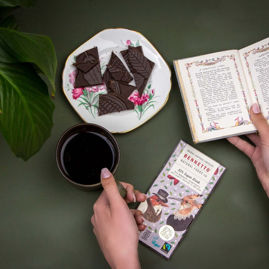 Enjoying 82% Super Dark chocolate with a book and coffee in an eco friendly online shop in Brighton and Hove.