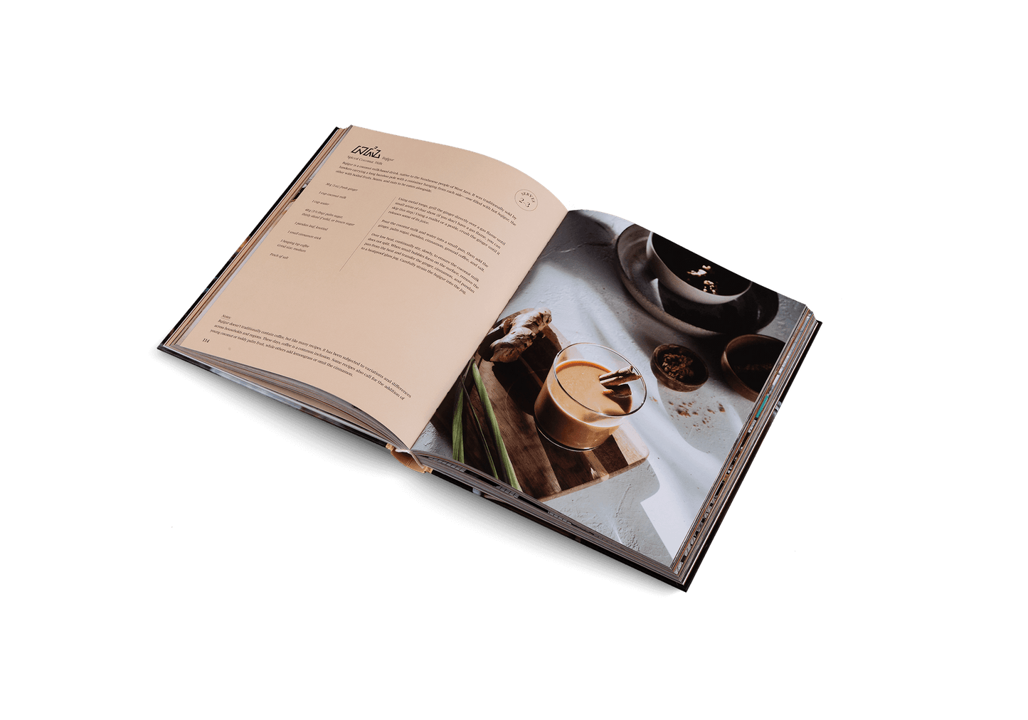 Open book with a photograph of a coffee cup and saucer on a white background