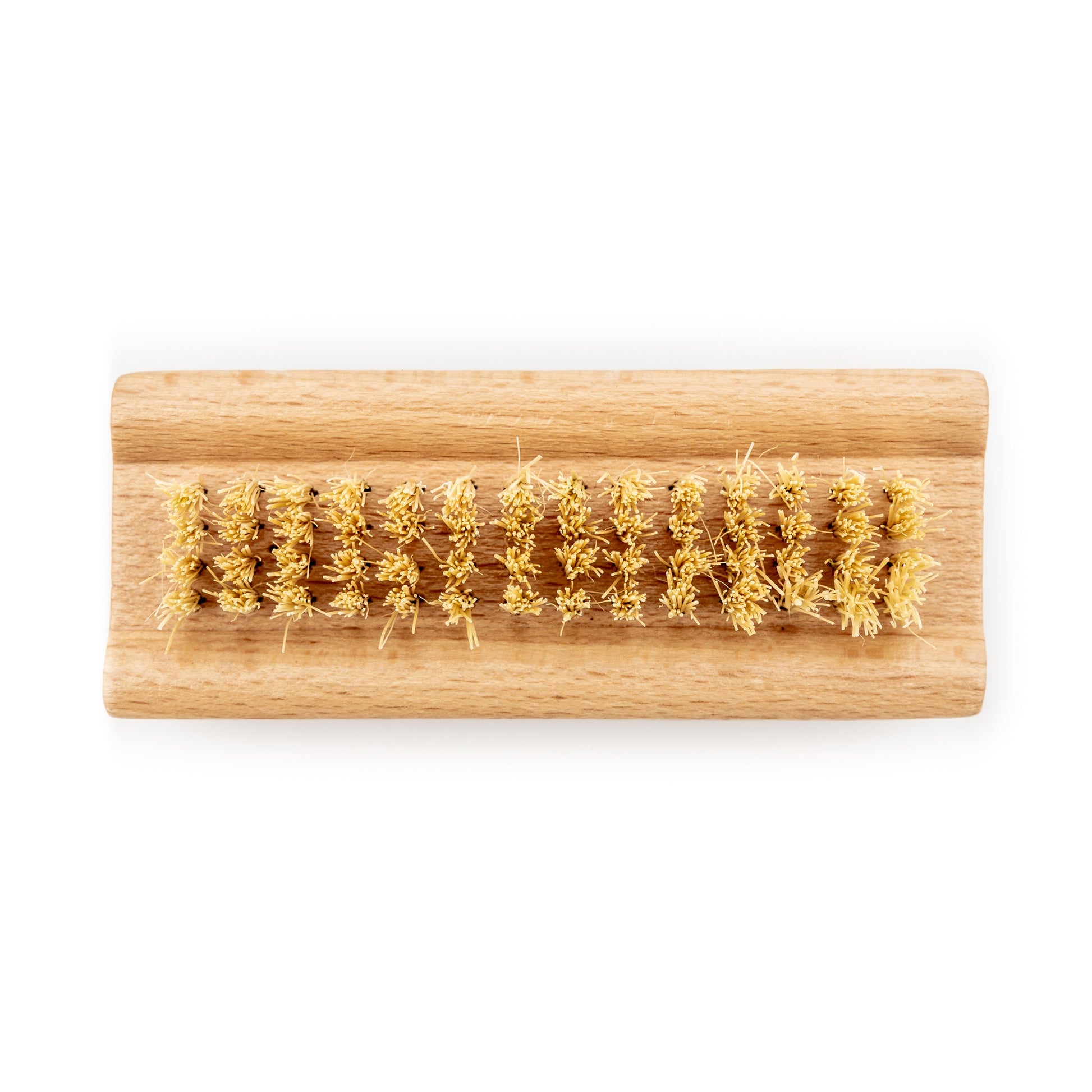 Wooden brush with natural bristles on a white background