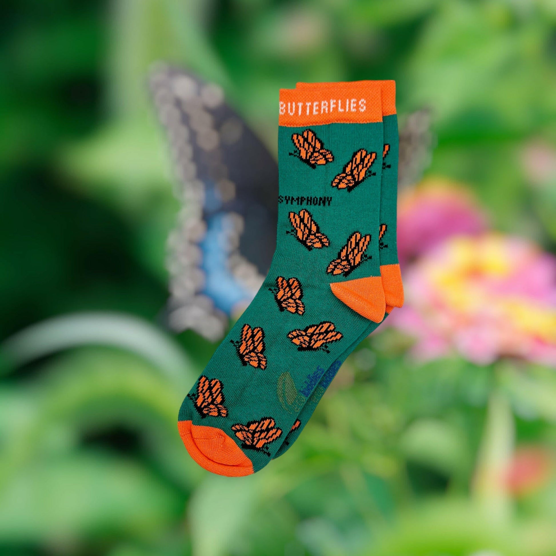 Sock with butterfly design in a garden setting