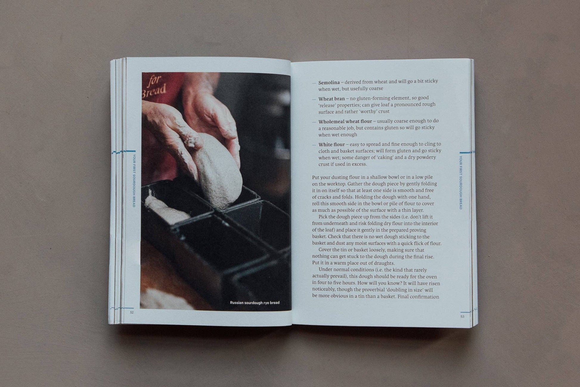 Open book with a recipe or cooking tutorial on a neutral background