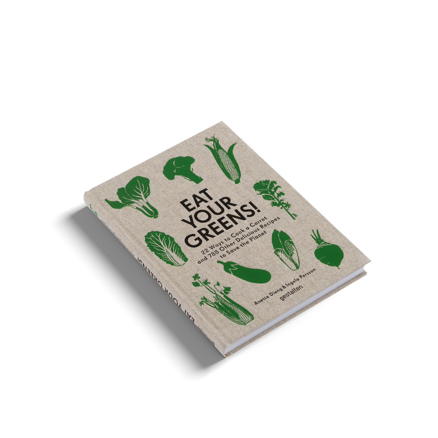 Book titled 'Eat Your Greens!' with green vegetable illustrations on a beige background