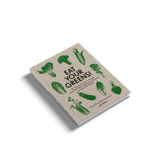 Book titled 'Eat Your Greens!' with green vegetable illustrations on a beige background