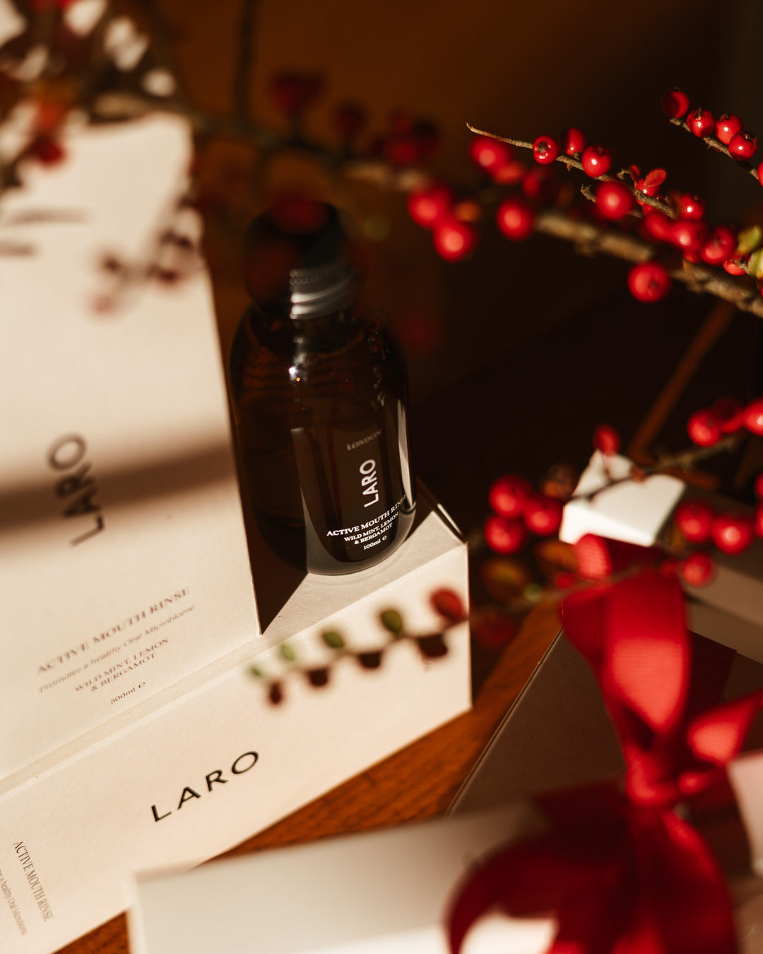 Travel Mouth Rinse, 100ml bottle displayed with decorative packaging and holiday elements.