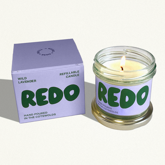 REDO candle and packaging on a white background