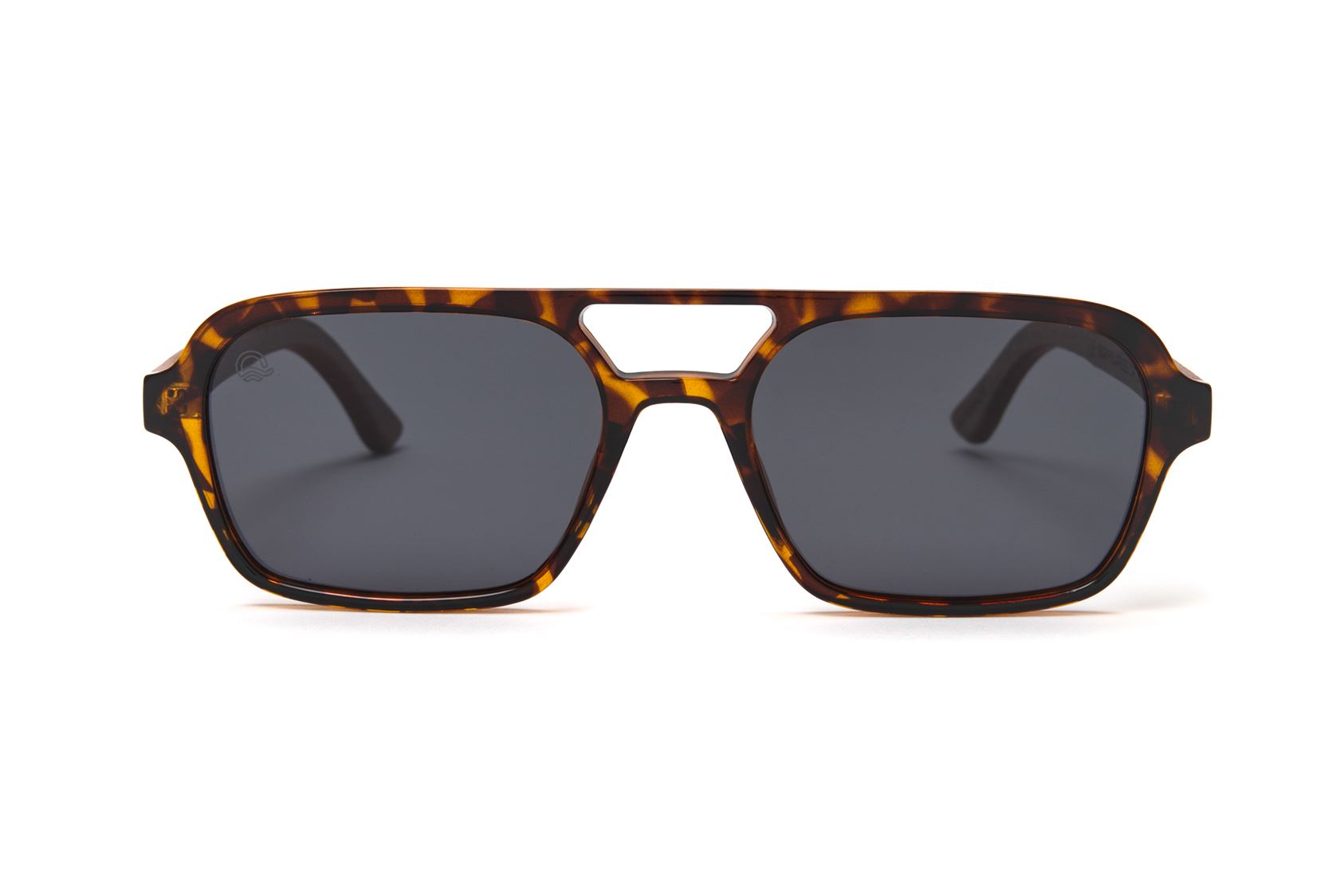Sunglasses with tortoiseshell frame and dark lenses on a white background