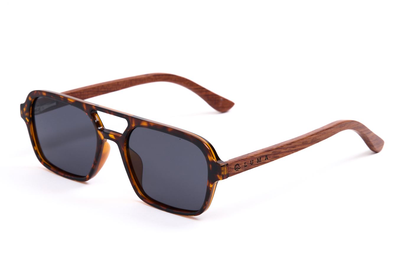 Sunglasses with tortoiseshell frame and dark lenses on a white background