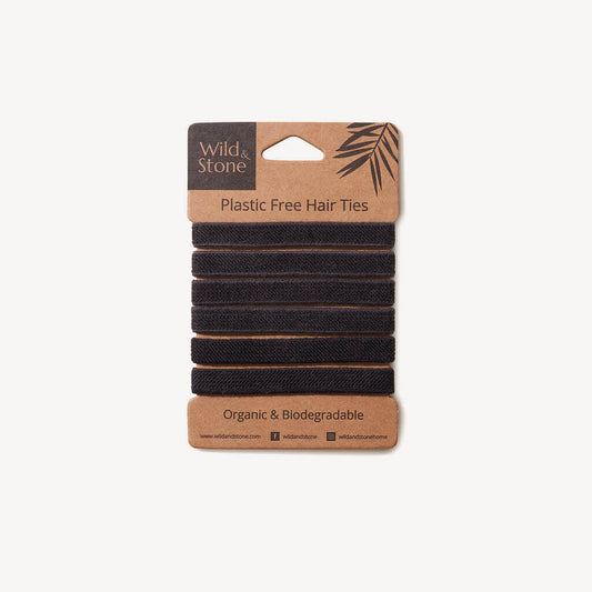 Pack of black hair ties with a 'Wild & Stone' label on a white background