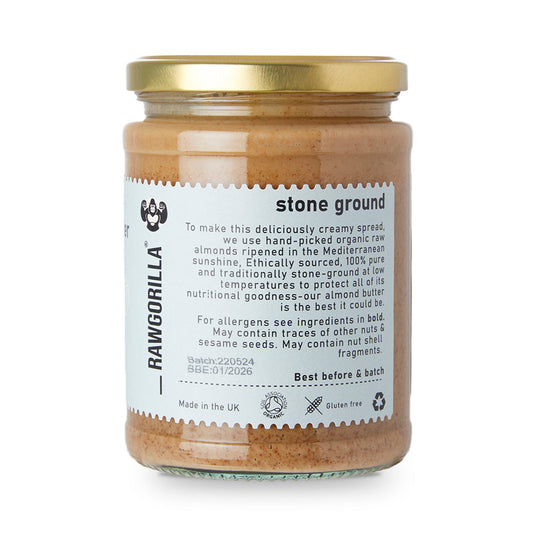 Jar of Rawgorilla stone ground almond butter with a gold lid on a white background