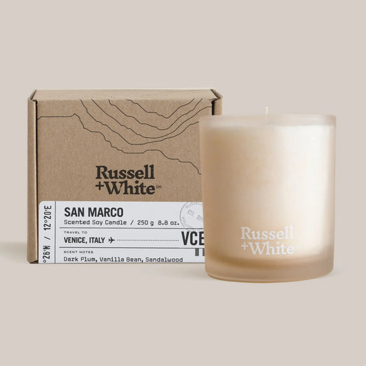 Russell + White candle and packaging on a light background
