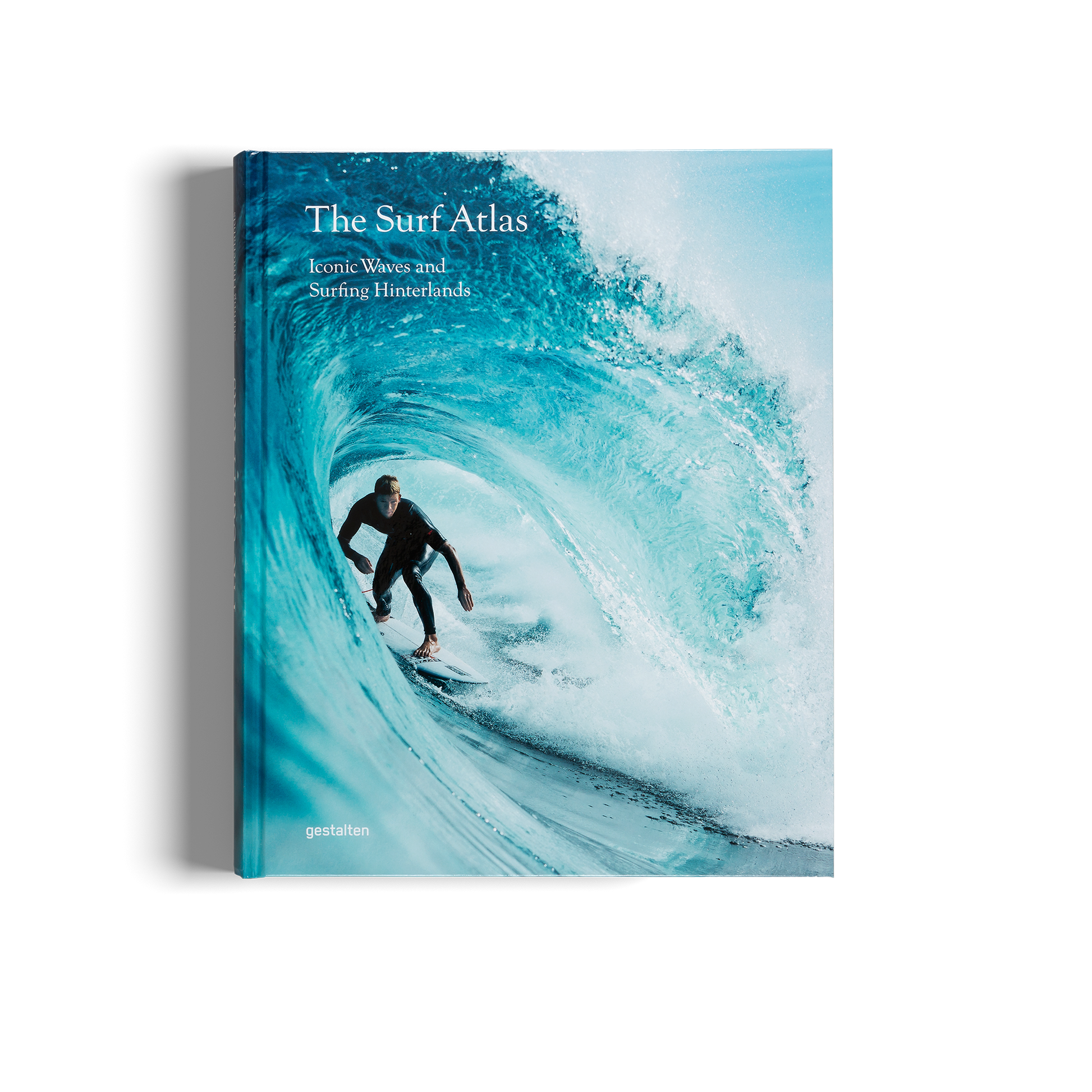Book titled 'The Surf Atlas' with a surfer on a wave on the cover