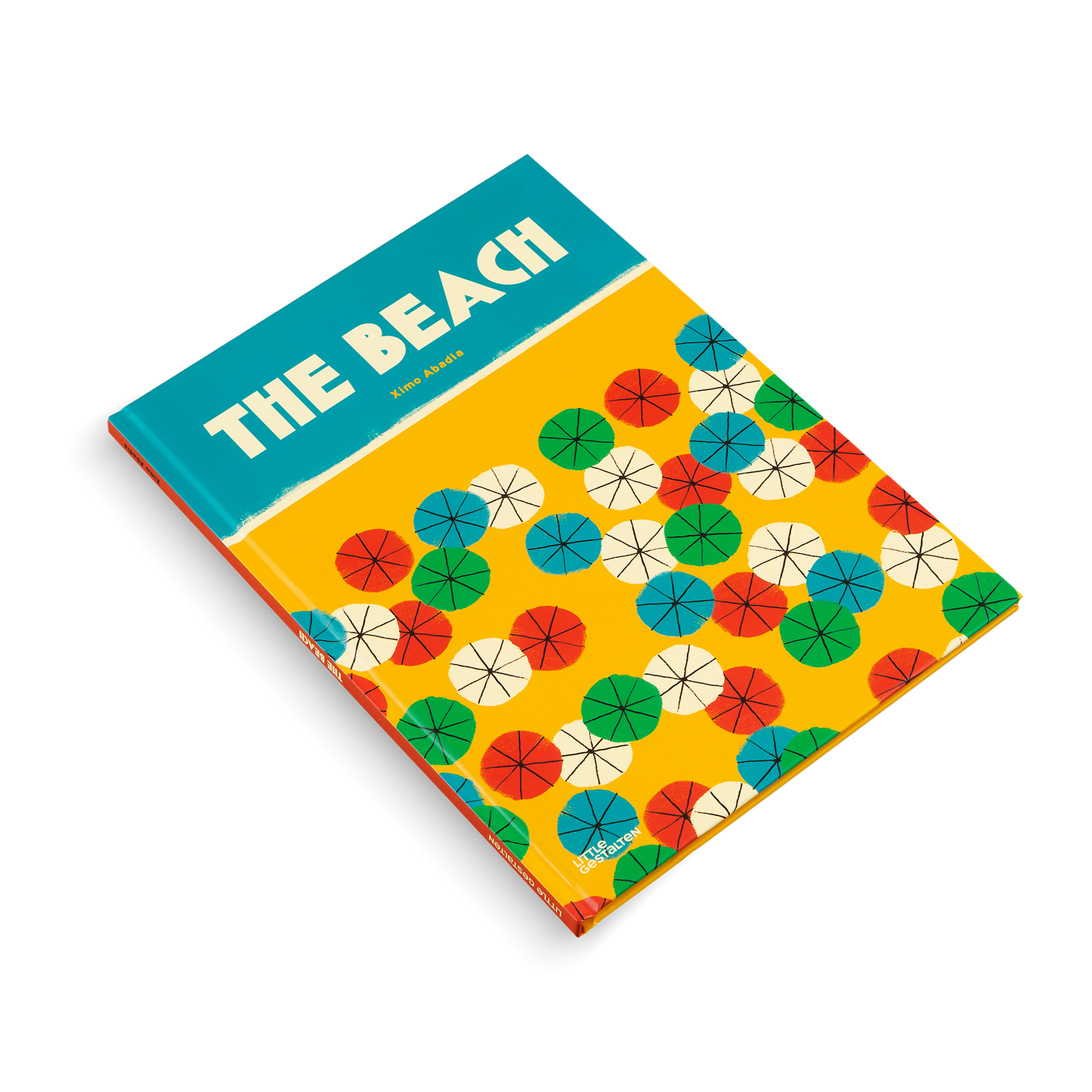 Book titled 'The Beach' with colorful umbrella pattern on a white background
