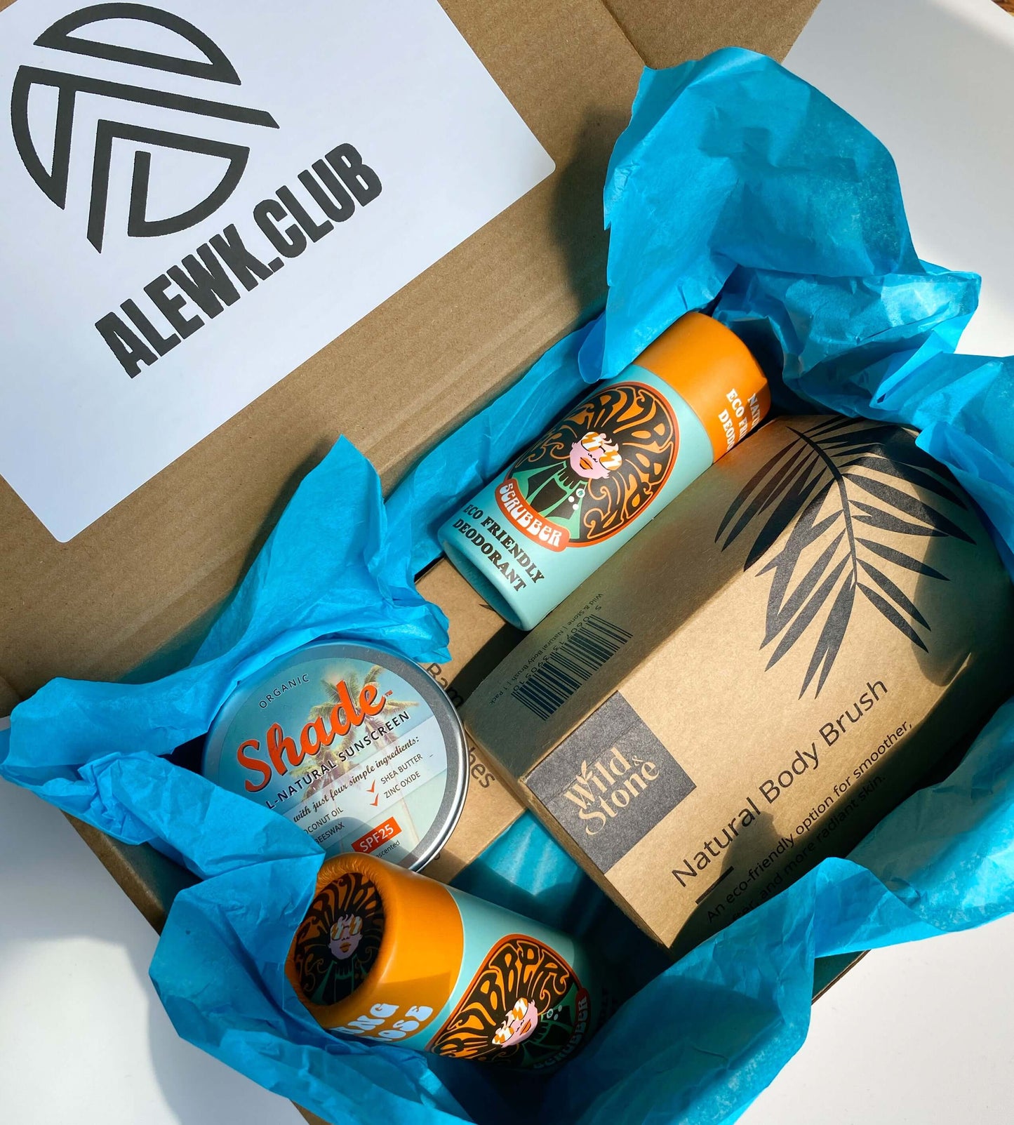 Eco Essentials Home Gift Set featuring bamboo toothbrushes, natural body brush, Ylang & Rose soap bars, and Shade all-natural sunscreen, arranged on a neutral background for a minimalist, sustainable lifestyle look