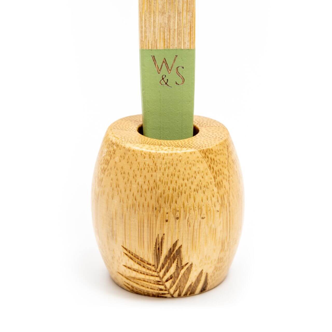 Bamboo utensil holder with engraved logo on a white background