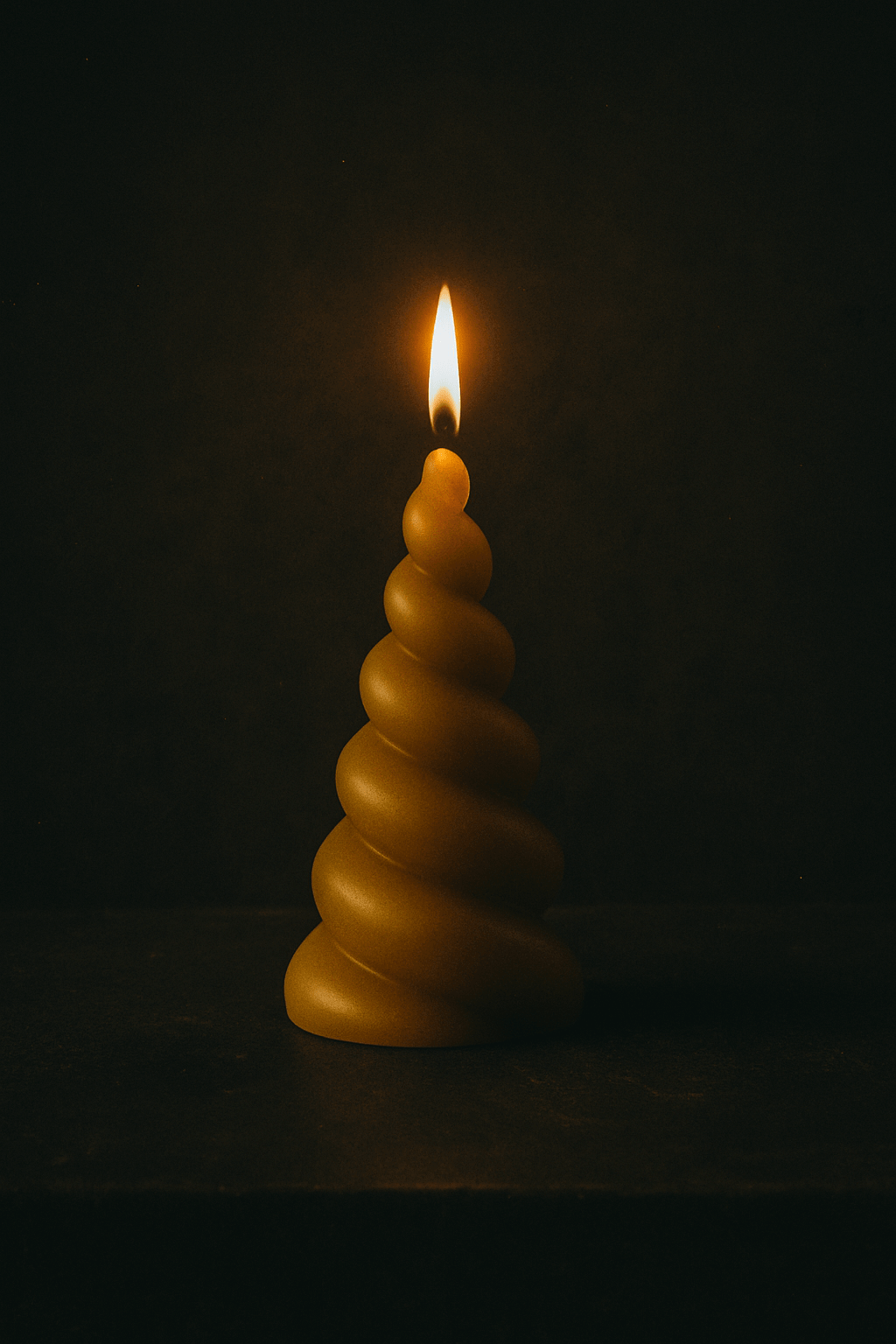 Unicorn horn shaped candle made of pure beeswax, 20cm tall with a long burning time.