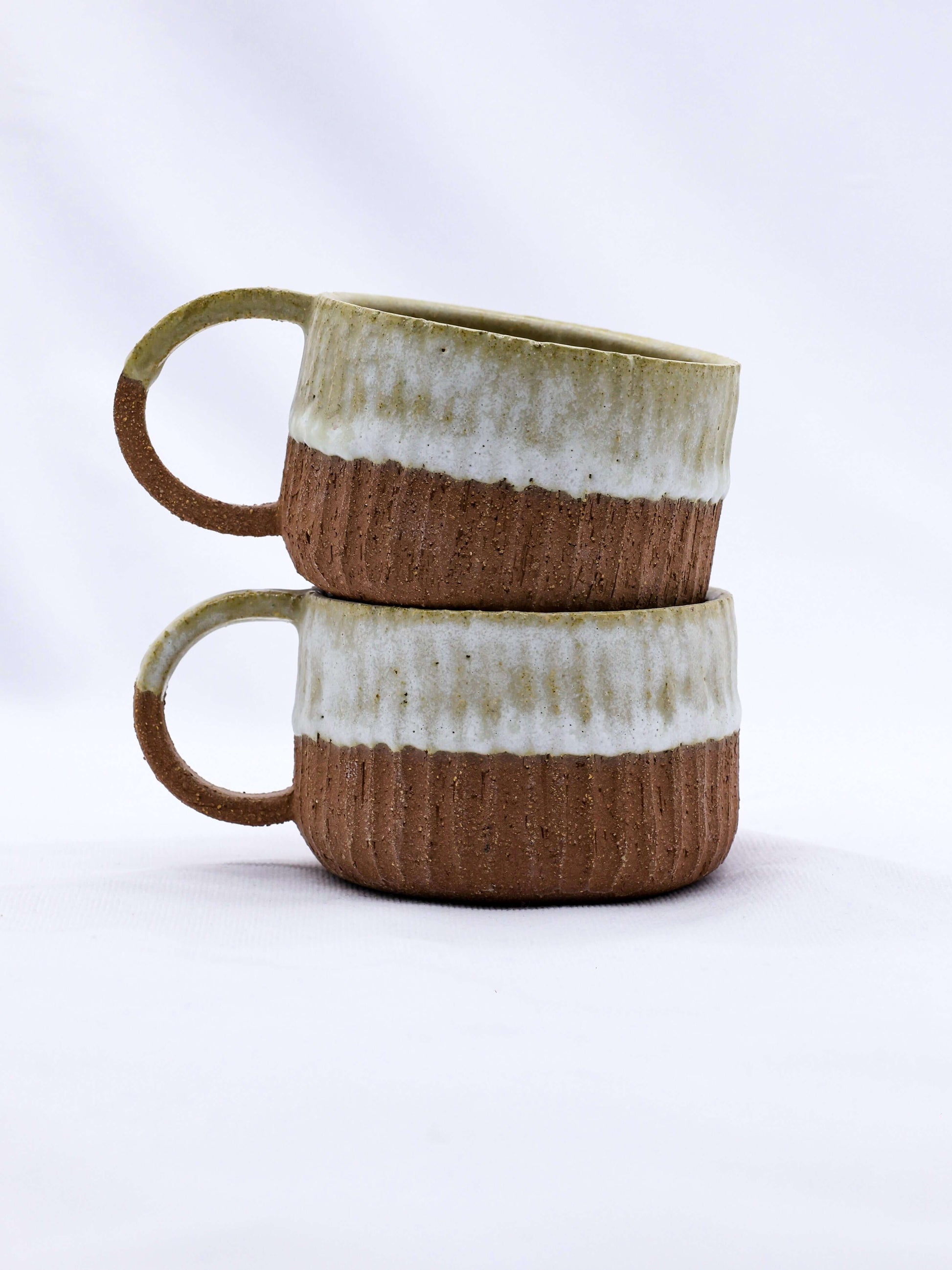 Bianca Arte Handmade Ceramic Terra Stoneware Mug stacked, showcasing eco-friendly design from Brighton and Hove.