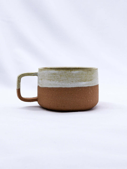 Bianca Grande Handmade Ceramic Terra Stoneware Mug showcasing its elegant two-tone design.