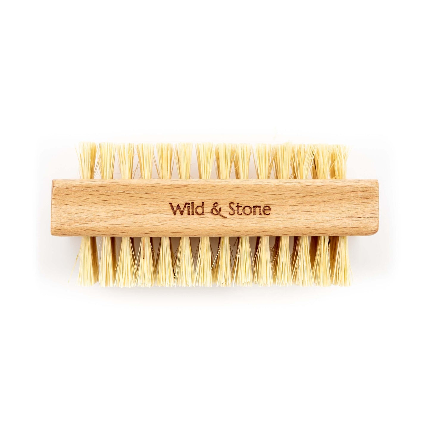 Wooden brush with yellow bristles and 'Wild & Stone' branding on a white background