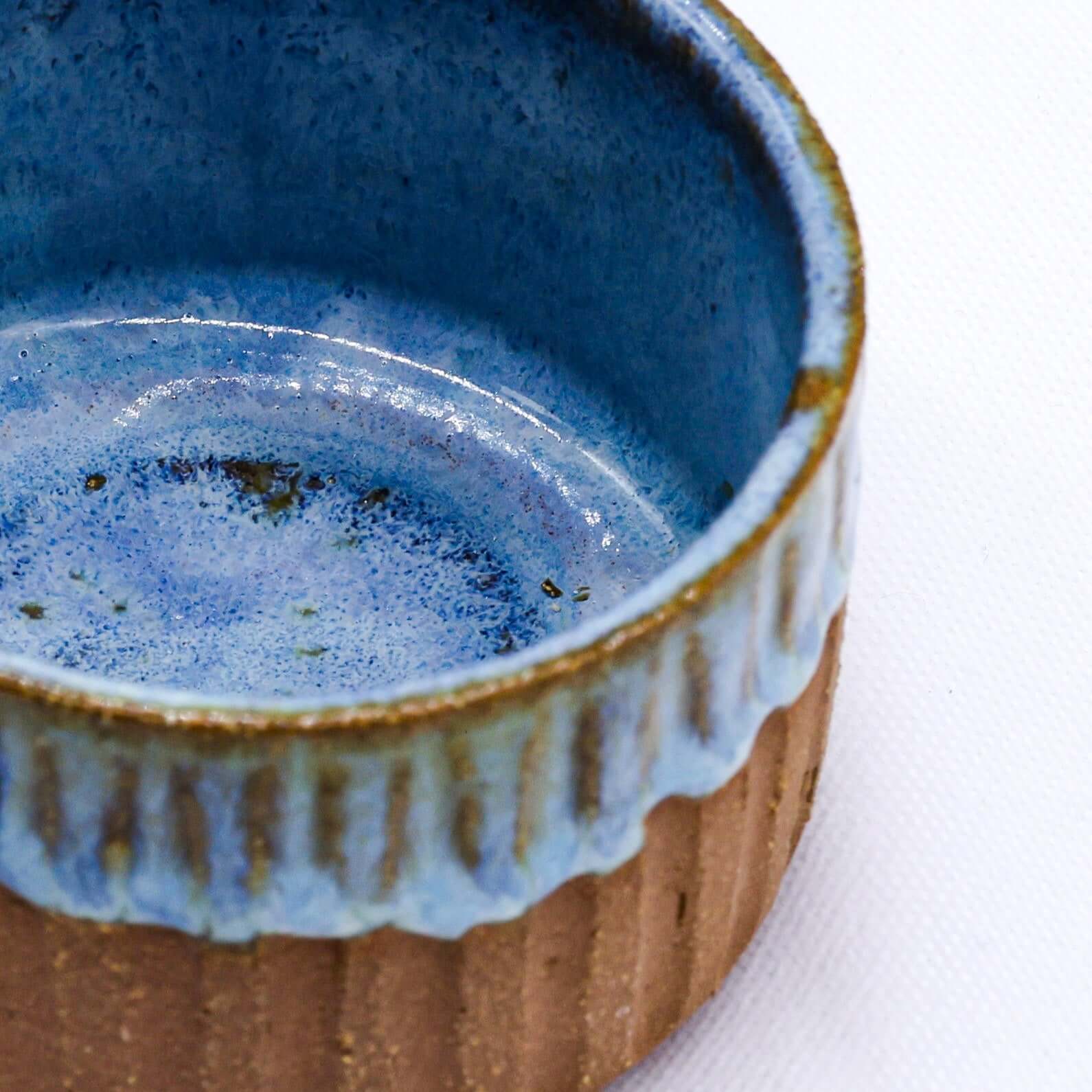 Bluvio Arte Handmade Ceramic Terra Stoneware Mug with a stunning blue interior and textured exterior.