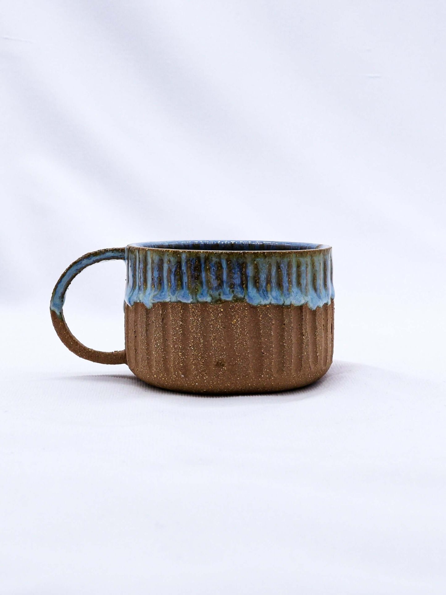 Bluvio Arte Handmade Ceramic Terra Stoneware Mug with unique blue and brown design, eco-friendly product from Brighton and Hove.