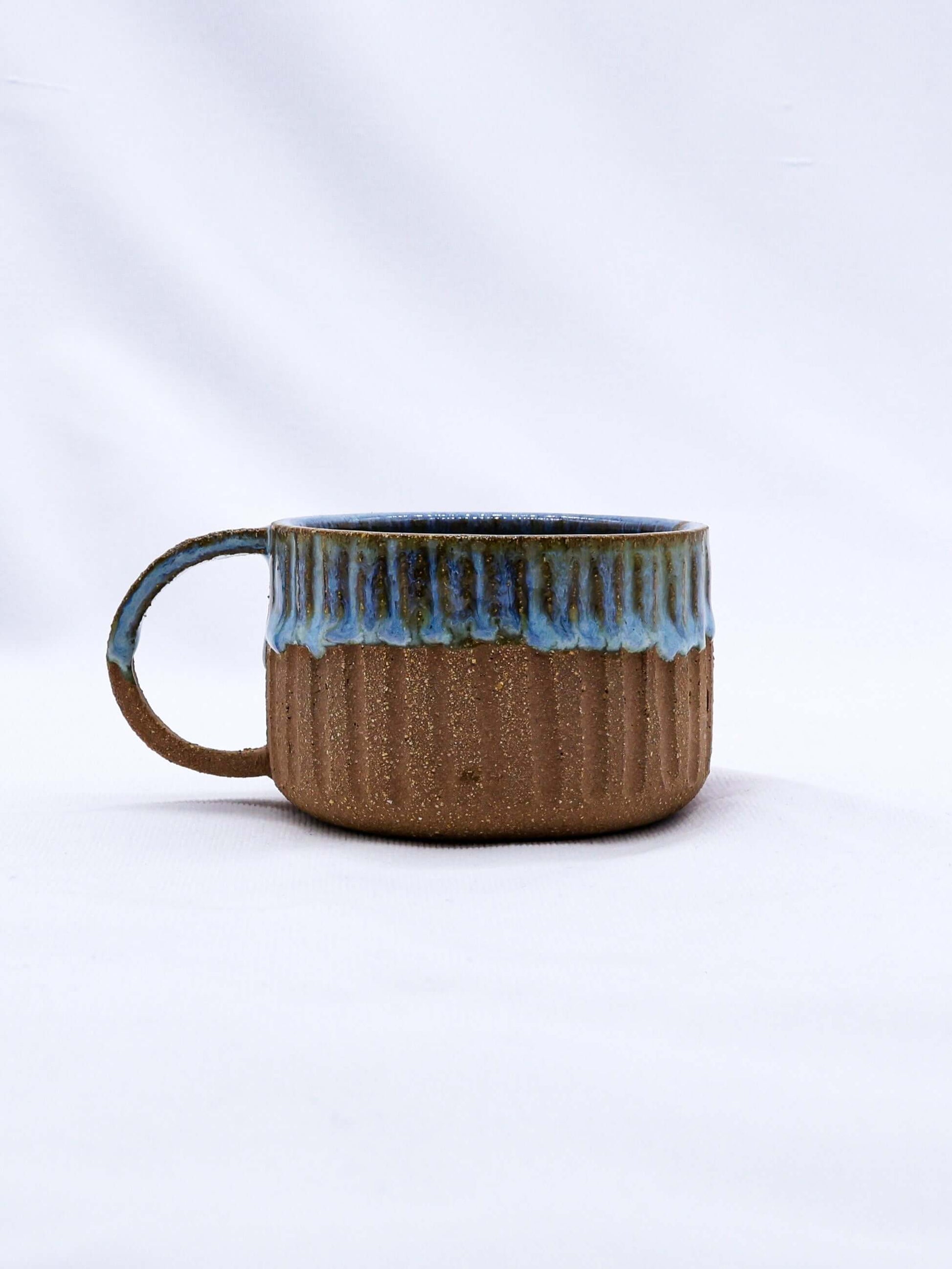 Bluvio Arte Handmade Ceramic Terra Stoneware Mug with unique blue and brown design, eco-friendly product from Brighton and Hove.