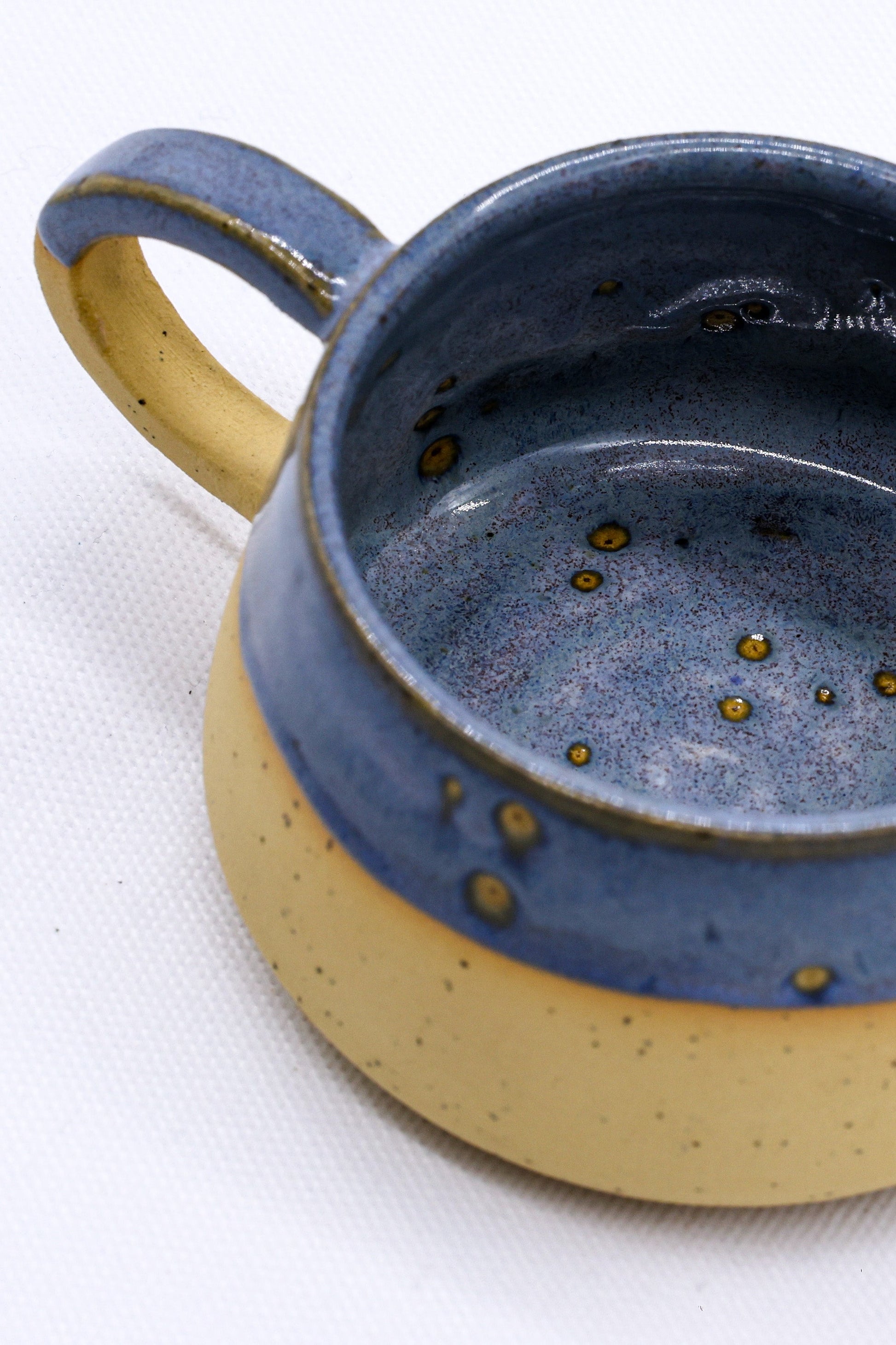 Bluvio Belluma Handmade Stoneware Ceramic Mug interior with blue and yellow glaze, perfect for eco friendly online shop in UK.