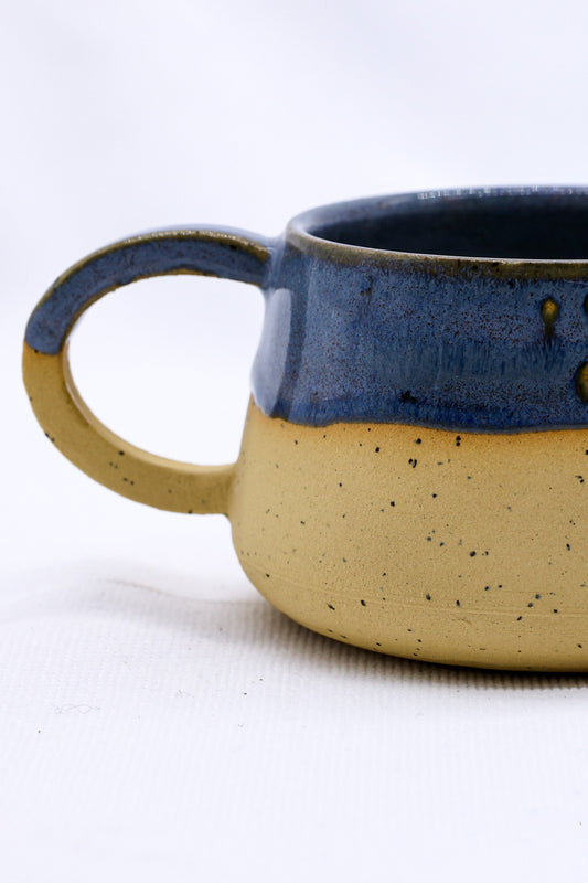 Bluvio Belluma Handmade Stoneware Ceramic Mug showcasing elegant blue and yellow design, eco-friendly, from UK, Brighton and Hove.